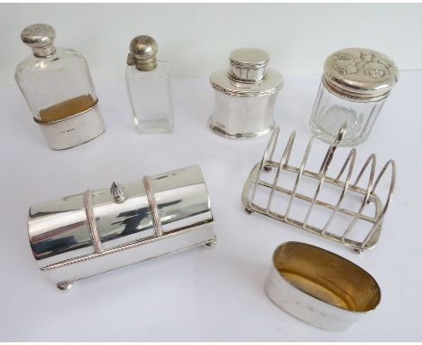 An assortment of silver and silver plate to include:a six-division hallmarked silver toast rack;a hallmarked silver tea-caddy