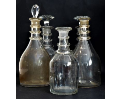 Five Georgian decanters - two pairs and one single:1. a pair of plain mallet decanters with triple annulated neck rings, one 