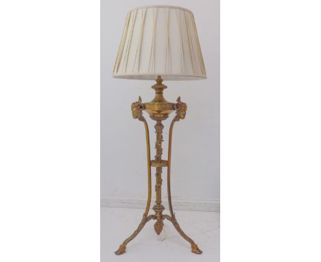 A fine 19th century height-adjustable brass oil lamp (converted to an electricity) in high Robert Adam style: three gilt-meta