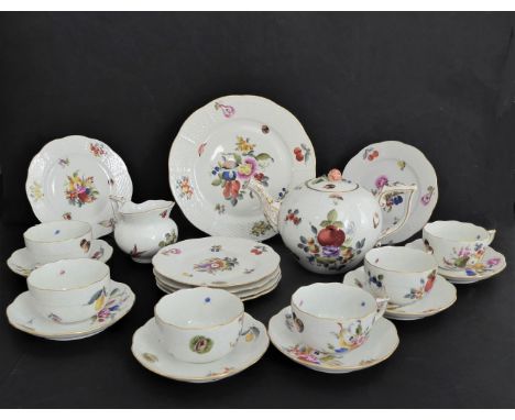 A six-place Herend Porcelain (Hungary) tea service, each piece individually decorated with fruits and varying floral sprays, 