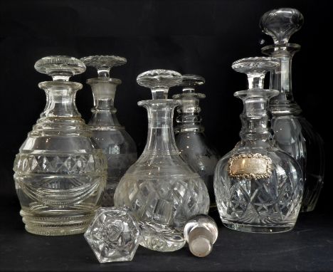 Four 19th century decanters, two later decanters and three decanter stoppers:1. a Victorian shaft-and-globe magnum decanter w