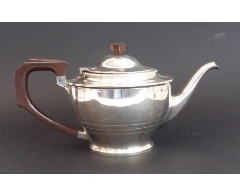 A hallmarked silver teapot with Art Deco geometric octagonal knop finial and similar angular geometric handle, engraved with 