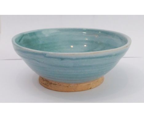 An early 20th century Omega Workshops turquoise glazed bowl: the outer reeded angular section above an unglazed circular foot