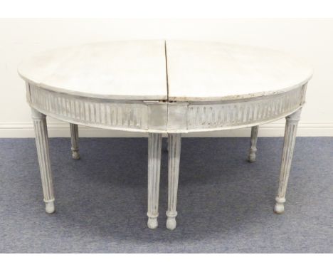 A pair of late 18th century style (later) shabby chic demi-lune console tables: each with slightly overhanging top above a re
