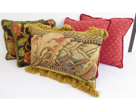 Five cushions (two pairs and one single):1. a decorative tapestry cushion with gold tassels2. a pair of red cushions 3. a pai