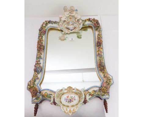 A large 19th century porcelain framed easel-style dressing table mirror (now minus rear stand). Two-winged cherubic figures s