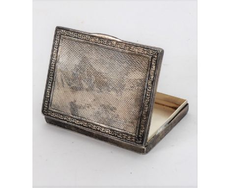 A late 19th to early 20th century continental white-metal box: the hinged lid with thumbpiece, Greek key-style border surroun