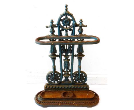 A 19th century cast urn stick stand: stylised floral cast decoration and with original drop-in oval iron base, traces of orig