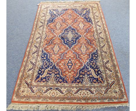 A modern Persian Tabriz carpet: central medallion with cobalt blue spandrels (overall good condition) (217cm long x 132cm wid