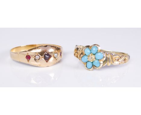 Two Victorian yellow gold rings: 1. a 15ct gold, garnet and seed pearl gyspy set ring, Chester 1884, size Q½; 2. an unmarked 