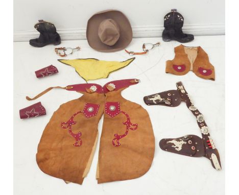 An unusual mid-20th century child's cowboy costume to include: hat, leather waistcoat and leather holster with replica red-pa