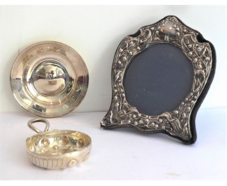 A group of three:a silver Art Nouveau inspired shaped photograph frame;a small modern hallmarked silver armada dish;a white-m