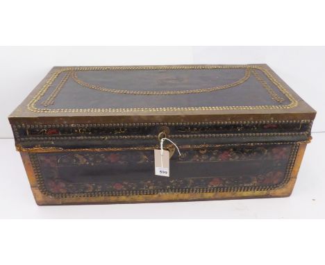 A good 19th century brass studded and mounted camphor wood and leather trunk: the body hand-decorated with scrolling foliage 