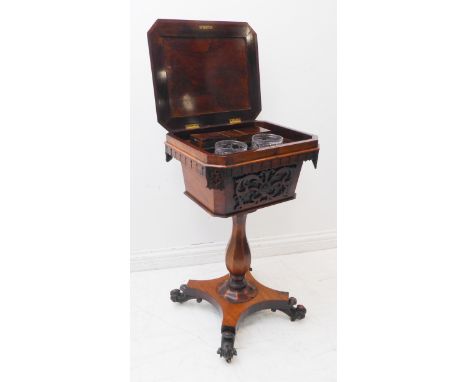 A late Regency period rosewood teapoy: the angular top with canted corners, hinged and opening to reveal a fitted interior wi