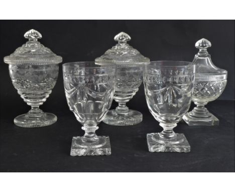 Five pieces:1. a pair of cut and engraved glass covered vases or bonbonnières: probably late 19th century, the bowls with thr