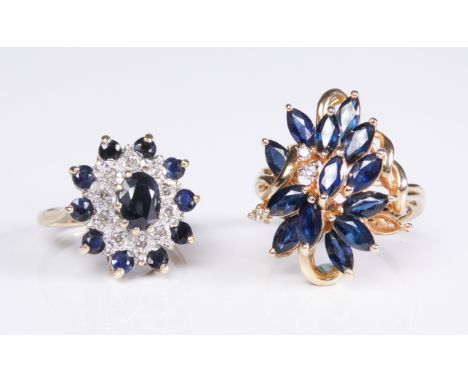 Two sapphire and diamond-set rings: the first of tiered design, set with navette-shaped sapphires and diamond detail, the sha