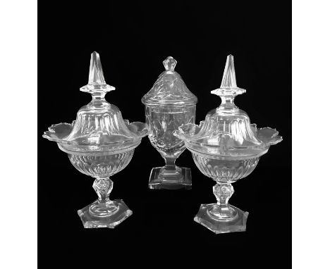 A pair and a single bonbonnière:1. A good pair of 19th century cut glass covered bonbonnières, possibly Voneche, of urn form 