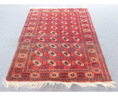 A North-East Iranian&nbsp;Turkeman carpet: red ground and guls (small hole, some damage to border) (200cm long x 141cm wide)