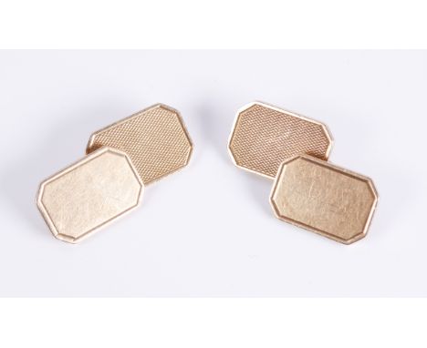 A pair of 9ct yellow gold cufflinks, hallmarked Birmingham 1959, octagonal with engine turned decoration. (11.8g)