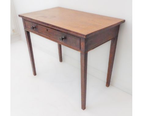 A late 18th to early 19th century mahogany side table: the slightly overhanging top above a single full-width drawer, raised 