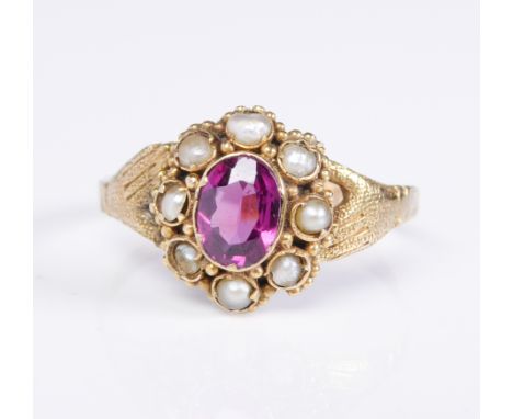 A Victorian 12ct gold, pink stone and seed pearl fede ring: hallmarked '12' and '.5', Birmingham, the two hands holding a see