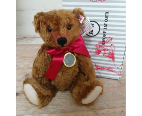 A Steiff limited edition bear 'Cinnamon - The £110,000 Bear', no.13/1904, with white tag, in original box with certificate.