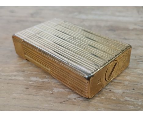 A Dupont gold plated Rollagas lighter, serial number 7793BS.