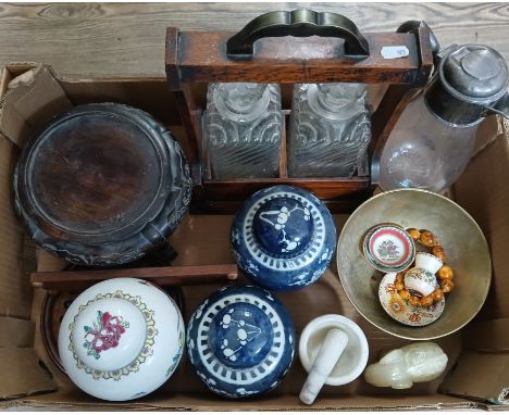 A box of assorted items including a tantalus, a hallmarked silver topped claret jug, Chinese porcelain, other oriental collec