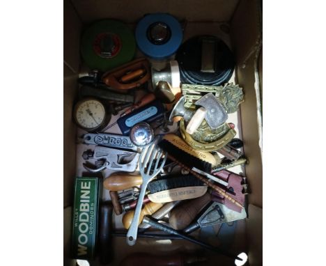 A box of assorted collectables including tools, bell, metal ware etc.
