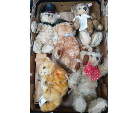 A box of assorted Steiff items to include 4 bears, a cat &amp; a watch.