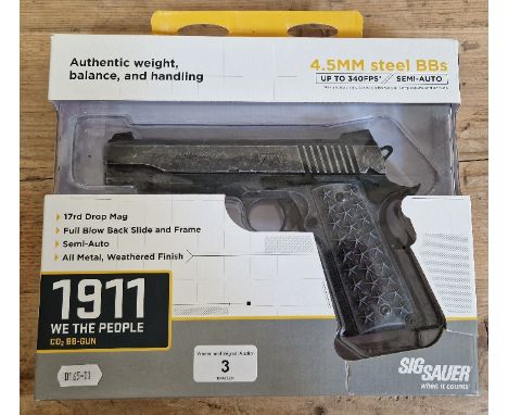 A Sig Sauer 1911 4.5mm calibre Co2 air BB gun, '1776, we the people', serial no.18306622, 20cm long, in original box with man