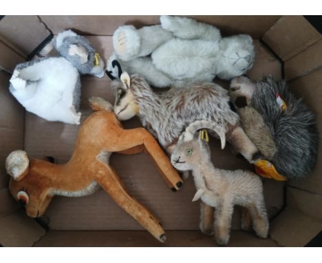 Five Steiff animals; two goats, bush baby, hedgehog and a deer.