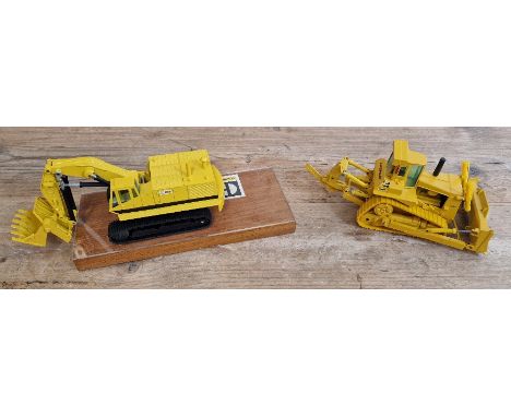 Two model costruction vehicles comprising of a NZG Caterpillar 245 no. 160-177 track-type excavator on plynth in box &amp; Co