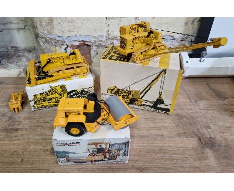 Three model costruction vehicles comprising of a Gescha CAT D9 track-type tractor in original box, a Gescha CAT 954 pipelayer