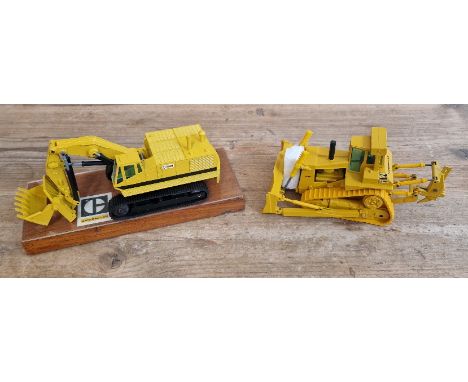 Two model costruction vehicles comprising of a NZG Caterpillar 245 no. 160-177 track-type excavator on plynth in box &amp; Co