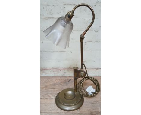 An early 20th century brass angle lamp by GEC (General Electric Company), with etched glass shade and weight base, height 51c