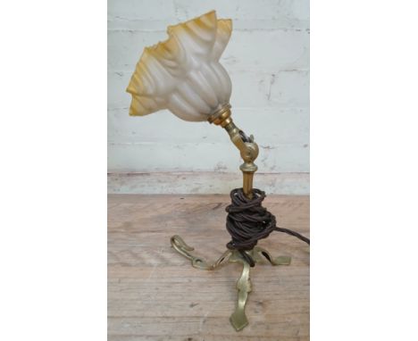 An early 20th century brass railway carriage angle lamp with yellow and frosted glass shade, height 34cm.