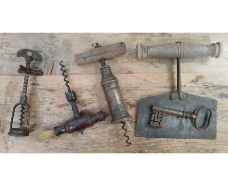 A mixed lot comprising a Thomason type corkscrew, two other corkscrews, a vegetable chopper and an antique key.