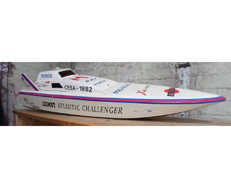 A large (4'6") radio controlled model speed boat with pull start petrol engine &amp; onboard radio equipment.