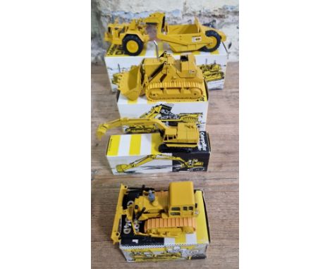 Four NZG model Caterpillar vehicles comprising of a CAT 621 wheel tractor no. 122 in original box, a CAT 983 track-type loade
