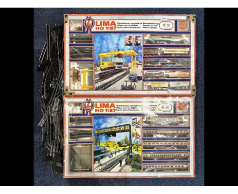 Two Boxed Sets of Lima HO Model Railways, container unloader set and two way signal with level crossing set.  one leg of the 