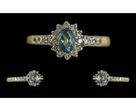 9ct Gold Aquamarine &amp; Diamond Cluster Ring, weight 1.65 grams, ring size M.  Oval central Aquamarine surrounded by diamon