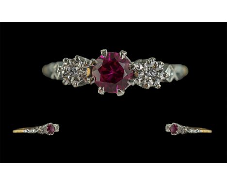 18ct Gold and Platinum Ruby and Diamond Set Ring. Marked 18ct and Platinum to Interior of Shank. The Faceted Ruby of Excellen