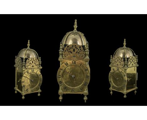 19th/20th Century Brass Lantern Clock, chapter dial with Roman numerals, dial mark Daniel Quare. Height 10''.