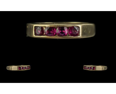 Ladies Attractive 9ct Gold Four Stone Ruby Set Ring, full hallmark to interior of shank.  The well-matched rubies of good col