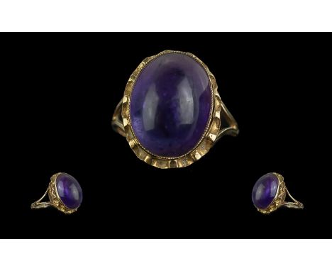 Ladies 9ct Gold Attractive Single Stone Amethyst Set Ring. Marked 9ct to Interior of Shank. The Cabouchon Cut Large Amethyst 