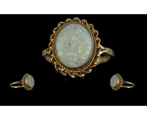Ladies - Attractive 9ct Gold Single Stone Opal Set Ring. Full Hallmark to Interior of Shank. The Oval Shaped Opal of Good Col