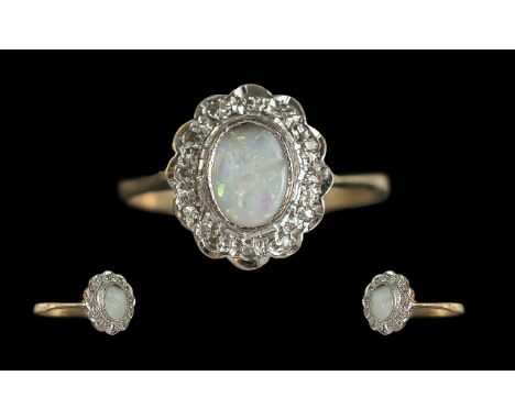 Ladies Attractive 9ct Gold Opal & Diamond Set Cluster Ring - Full Hallmark to Shank. The Oval Shaped Opal Surrounded by Diamo