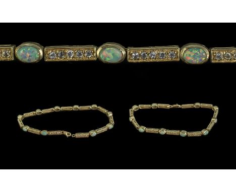 14ct Gold - Attractive Opal and Diamond Set Line Bracelet, Marked 14ct. The Ten Well Matched Opals of Excellent Colour, With 