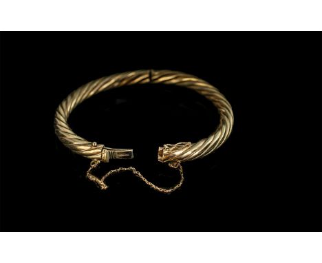 9ct Gold Bangle with Safety Chain &amp; Catch, In Twist Type Design. Stamped for 9ct. 18.46 grams. Approx Size 7 by 6 cms. 